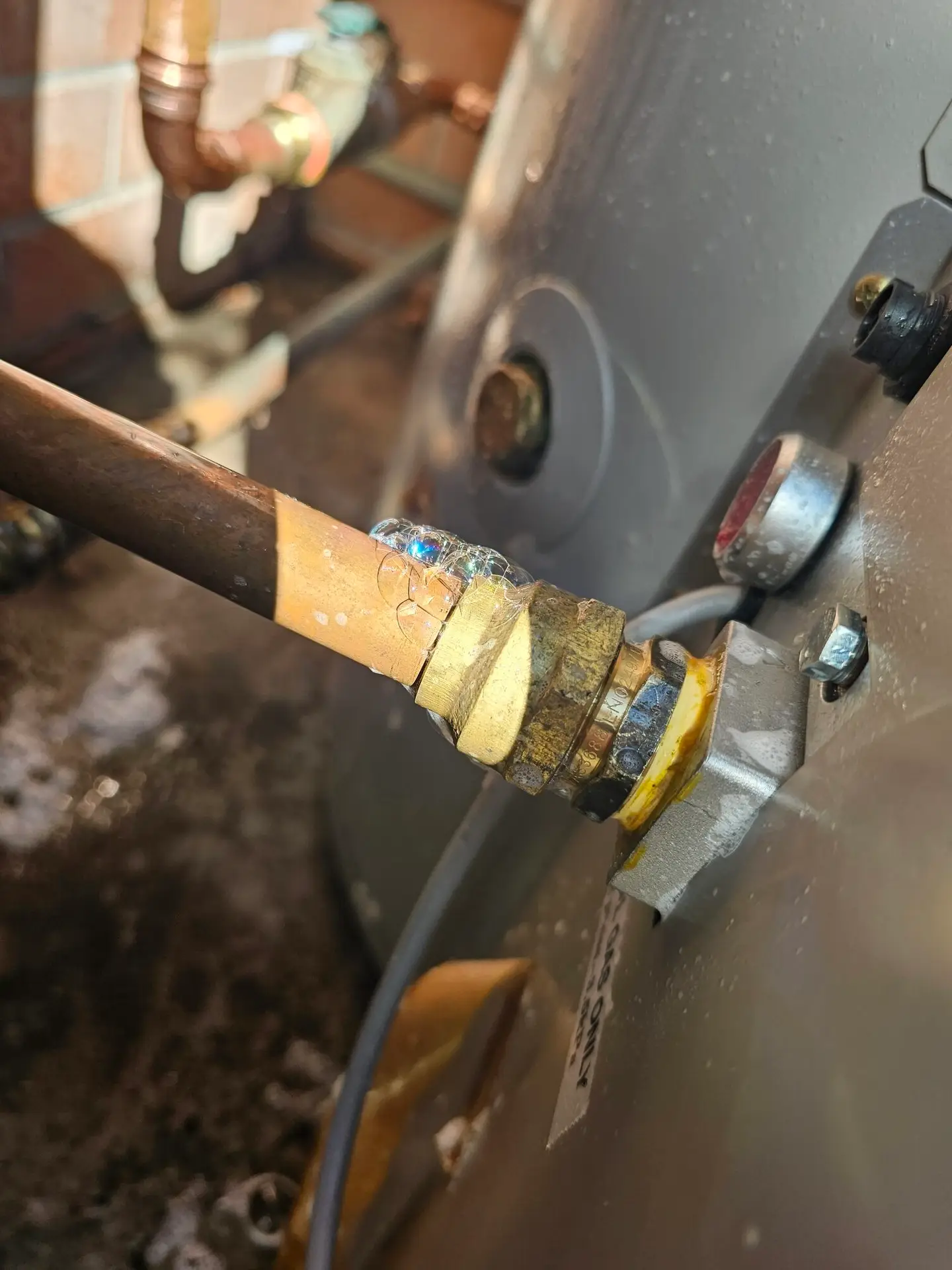 Soap bubbles showing gas leak.